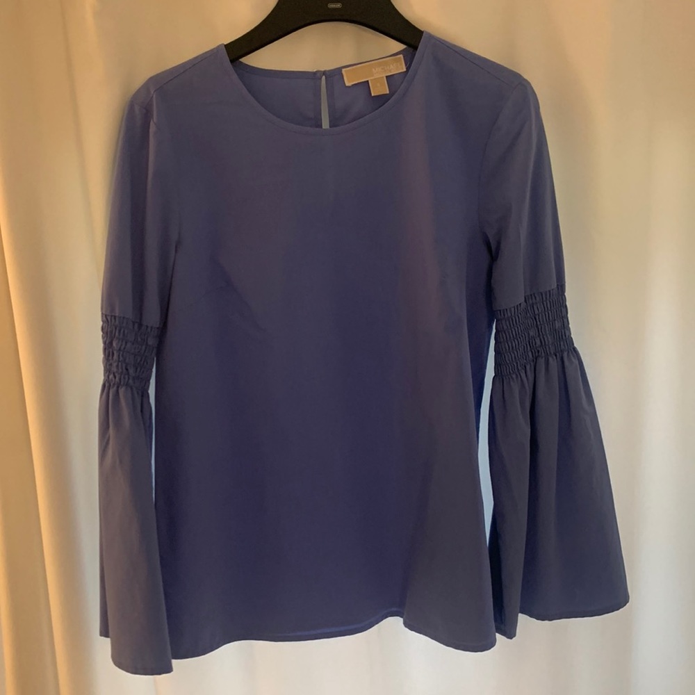 Micheal Kors blue long sleeve blouse in new condition! Size small.